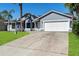Charming one-story home with driveway and lawn at 1842 W Cooper Dr, Deltona, FL 32725