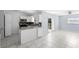 Open kitchen with stainless steel appliances, breakfast bar, and sliding doors at 1842 W Cooper Dr, Deltona, FL 32725