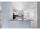 Spacious kitchen offers stainless appliances, tile backsplash and pass through breakfast bar at 1842 W Cooper Dr, Deltona, FL 32725