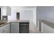 Open concept kitchen with granite countertops, stainless steel appliances, and tile flooring at 1842 W Cooper Dr, Deltona, FL 32725