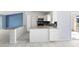 Bright kitchen features an eat in bar, stainless steel appliances and white cabinets at 1842 W Cooper Dr, Deltona, FL 32725