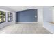 Open living room with tiled floors and a bay window offering natural light at 1842 W Cooper Dr, Deltona, FL 32725
