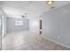 Open-concept living room with tile floors, fan, and natural light at 1842 W Cooper Dr, Deltona, FL 32725