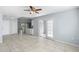 Open-concept living room with tile flooring and lots of natural light at 1842 W Cooper Dr, Deltona, FL 32725