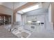 Kitchen featuring white cabinetry, stainless steel appliances, and a breakfast bar at 1860 Turnbull Lakes Dr, New Smyrna Beach, FL 32168