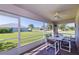 Spacious screened lanai providing views of the property's manicured lawn and surrounding neighborhood at 1860 Turnbull Lakes Dr, New Smyrna Beach, FL 32168