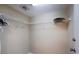 Functional walk-in closet with shelving and ample storage space for clothes and accessories at 1860 Turnbull Lakes Dr, New Smyrna Beach, FL 32168