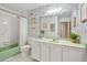 Charming bathroom with floral wallpaper, a bathtub, and a vanity, creating a cozy and functional space at 1926 Ocean Shore Blvd # 3050, Ormond Beach, FL 32176