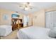 Bedroom features a ceiling fan, providing a comfortable and inviting space for relaxation and peaceful rest at 1926 Ocean Shore Blvd # 3050, Ormond Beach, FL 32176