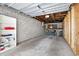 Spacious unfinished garage with exposed ceiling and concrete block walls at 1926 Ocean Shore Blvd # 3050, Ormond Beach, FL 32176