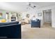 Cozy living room with neutral tones, comfortable seating, and a ceiling fan, perfect for relaxation at 1926 Ocean Shore Blvd # 3050, Ormond Beach, FL 32176