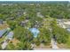 Property aerial highlights mature trees and landscaping; includes a long driveway for ample parking at 1927 Orange Tree Dr, Edgewater, FL 32141