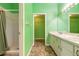 En-suite bathroom with shower, vanity, and walk-in closet, offering ample space at 1927 Orange Tree Dr, Edgewater, FL 32141