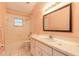 Bright bathroom with tile flooring, bathtub and shower combo, toilet, and a vanity at 1927 Orange Tree Dr, Edgewater, FL 32141