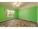 Spacious bedroom featuring bright walls and a large window for natural light at 1927 Orange Tree Dr, Edgewater, FL 32141