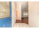 Entryway leading to the living area, featuring tile flooring and a bright interior at 1927 Orange Tree Dr, Edgewater, FL 32141