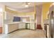 Spacious kitchen with white cabinets, modern appliances, and plenty of counter space at 1927 Orange Tree Dr, Edgewater, FL 32141