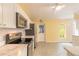 Cozy kitchen featuring white cabinets, a stainless steel range, and a convenient breakfast bar at 1927 Orange Tree Dr, Edgewater, FL 32141