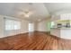 Spacious living area with wood floors, ceiling fans, and an open floor plan at 1927 Orange Tree Dr, Edgewater, FL 32141