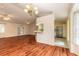 Inviting living room with wood floors, dining area, and a view into the kitchen at 1927 Orange Tree Dr, Edgewater, FL 32141