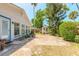 Private brick patio featuring a shed, mature landscaping, and a serene outdoor space at 1927 Orange Tree Dr, Edgewater, FL 32141