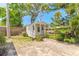 Charming shed with a brick path, nestled in a lush, private backyard setting at 1927 Orange Tree Dr, Edgewater, FL 32141