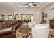 Comfortable living room featuring hardwood floors, a neutral color palette, and sliding doors to the patio at 202 Westcott Ct, Deland, FL 32724
