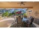 A covered and screened patio area with seating and outdoor decor at 202 Westcott Ct, Deland, FL 32724