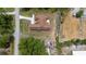 Aerial view of the property showcasing the home's layout, driveway, and surrounding landscape at 2048 Laredo Dr, Deltona, FL 32738