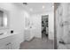 Bathroom with a shower, single vanity, decorative mirror, and tile flooring at 2048 Laredo Dr, Deltona, FL 32738