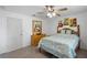 Bedroom featuring a full bed, ceiling fan, and dresser at 2048 Laredo Dr, Deltona, FL 32738