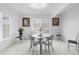 Eat-in kitchen with large window and modern chandelier at 2048 Laredo Dr, Deltona, FL 32738