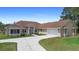 Spacious single-story home boasts a concrete driveway, attached garage, and well-maintained lawn at 2048 Laredo Dr, Deltona, FL 32738