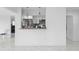 Open kitchen with granite countertops, stainless steel appliances and white cabinets at 2048 Laredo Dr, Deltona, FL 32738