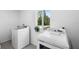 Laundry room featuring a washer, dryer, and window with exterior views at 2048 Laredo Dr, Deltona, FL 32738