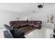 Living room with projector and large leather sectional sofa at 2048 Laredo Dr, Deltona, FL 32738