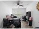 Home office with desk, chairs, bookshelves, and ceiling fan at 2048 Laredo Dr, Deltona, FL 32738