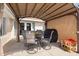 Covered patio featuring comfortable seating and an outdoor dining area, perfect for entertaining at 2048 Laredo Dr, Deltona, FL 32738
