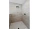 Walk-in shower with tile and new shower head at 2048 Laredo Dr, Deltona, FL 32738