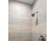 Shower detail showing tile surround and brushed-nickel fixtures at 2048 Laredo Dr, Deltona, FL 32738