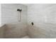 Shower detail with modern showerhead and neutral tile surround at 2048 Laredo Dr, Deltona, FL 32738
