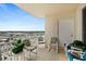 Spacious balcony with comfortable seating offers an inviting outdoor living space and city views at 2071 S Atlantic Ave # 705, Daytona Beach, FL 32118