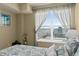 Bright bedroom featuring beach view, a plush bed with ocean-themed decor, and coastal accents at 2071 S Atlantic Ave # 705, Daytona Beach, FL 32118