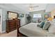 Bedroom showcasing wood furniture, a decorative mirror, tv, and ocean views at 2071 S Atlantic Ave # 705, Daytona Beach, FL 32118