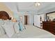 Bedroom showcasing an ornate bed frame, ensuite bathroom and walk-in closet at 2071 S Atlantic Ave # 705, Daytona Beach, FL 32118