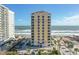 Gorgeous condo building featuring tan and yellow facade and wonderful ocean view at 2071 S Atlantic Ave # 705, Daytona Beach, FL 32118