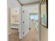Hallway leading to bedrooms with ceiling fans and scenic views at 2071 S Atlantic Ave # 705, Daytona Beach, FL 32118