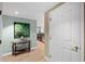 Inviting hallway featuring a console table and colorful artwork at 2071 S Atlantic Ave # 705, Daytona Beach, FL 32118