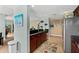 Charming kitchen featuring stainless steel appliances, dark wood cabinets, and colorful decor for a cozy touch at 2071 S Atlantic Ave # 705, Daytona Beach, FL 32118