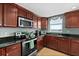 Well-equipped kitchen featuring granite countertops, stainless appliances, and great natural light at 2071 S Atlantic Ave # 705, Daytona Beach, FL 32118